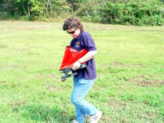 Worker Applying Pesticides to Lawn